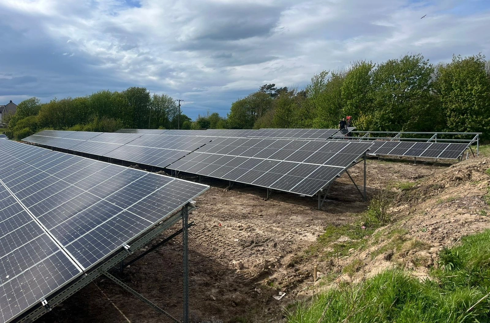 view of commercial solar installation on a large roof
