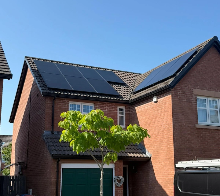 A sleek home battery storage unit installed in a garage