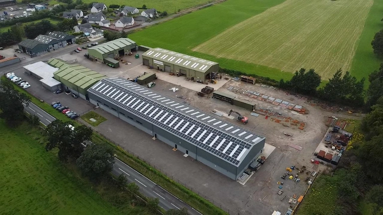 Drone view of a farm roof with a full solar installation